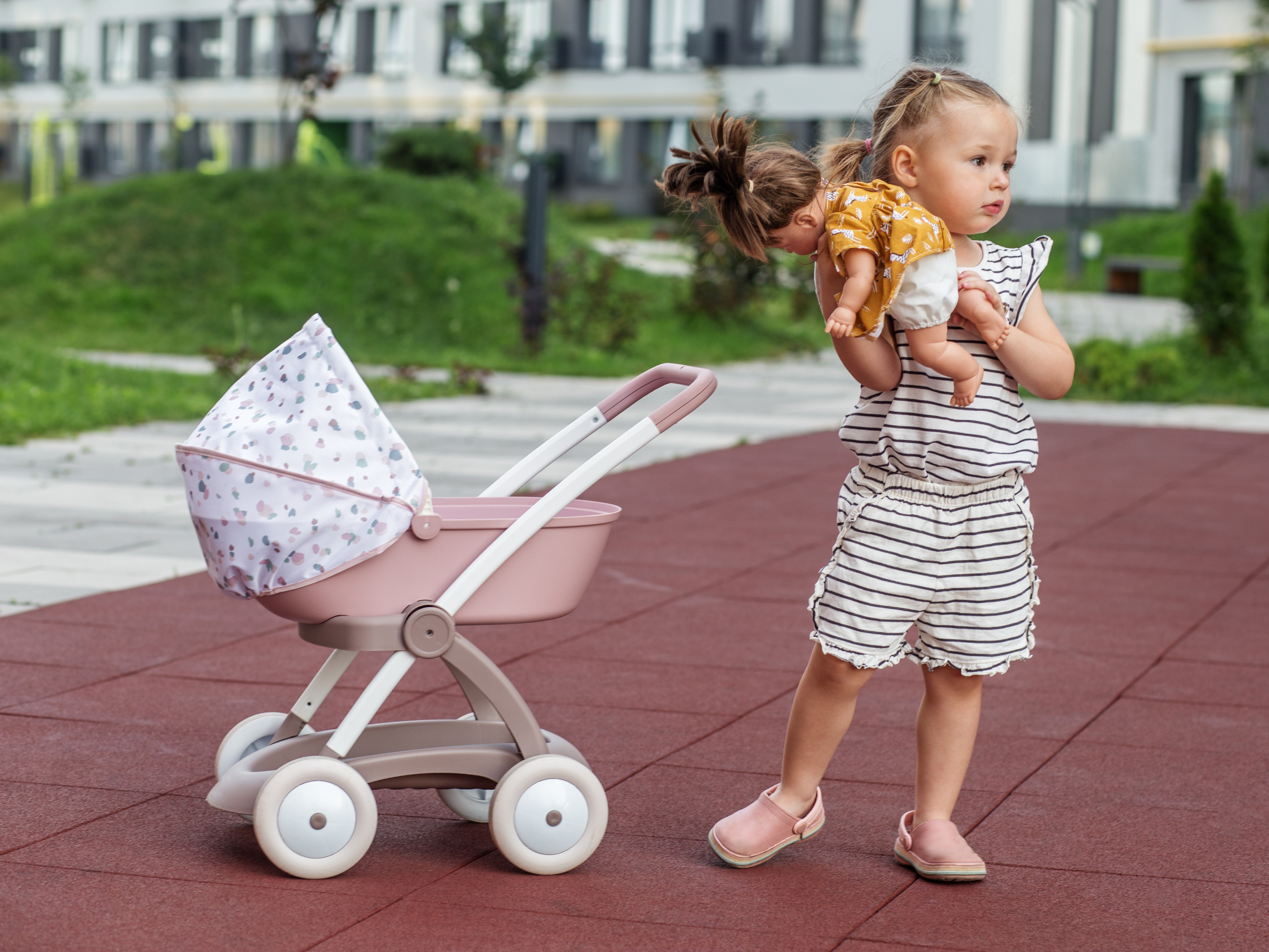 6 little-girl-with-doll-stroller-two-years-old-developmental-milestones-early-years.jpg