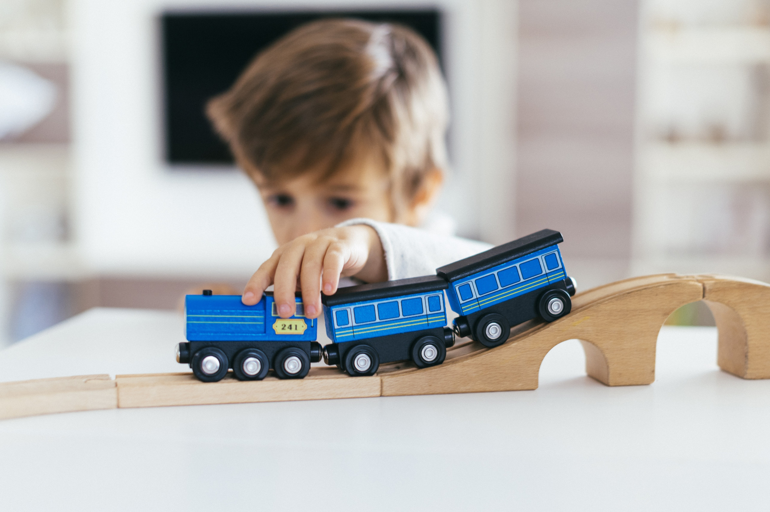 6 kid-playing-with-toy-train.jpg